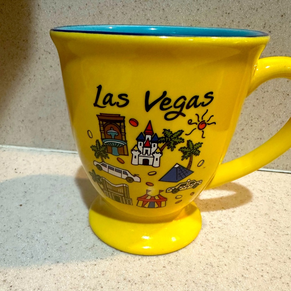 Las Vegas fun coffee mug.  Holds 12 ounces.  Heart Las Vegas bright yellow